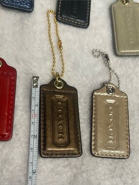 Choice of 1 COACH Various Leather Hang Tag Keychains:
1 for $15 or 2 for $25